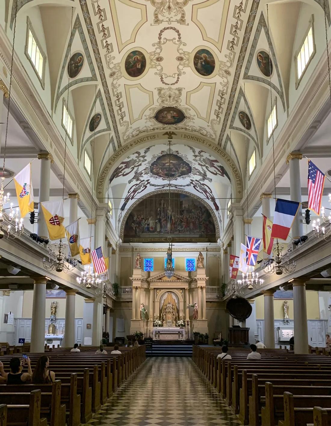 The nave with flags and checkerboard aisle